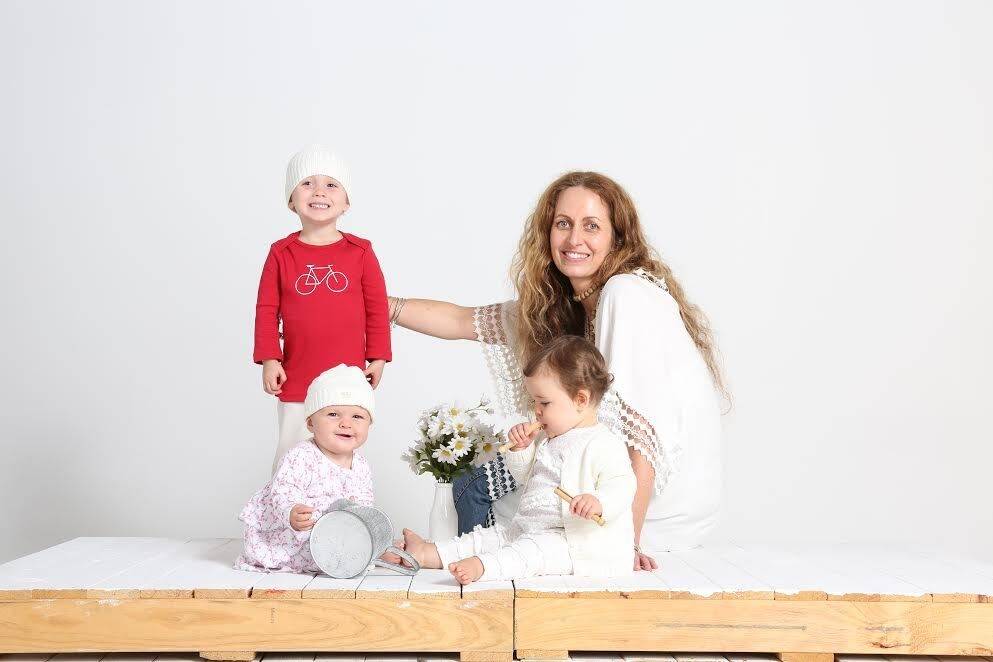 Former Canberra Girls' Grammar student and Mother of the Australian
organic babywear industry, Annette Francis, has been nominated for the
2015 National Ausmumpreneur Awards. She is with children modelling her designs Photo: act\megan.doherty