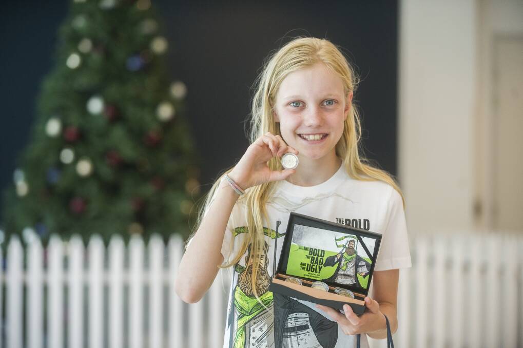 The first coin strike of 2019 is given to winner Celeste Weerts, pictured, at the Royal Australian Mint. Photo: Dion Georgopoulos