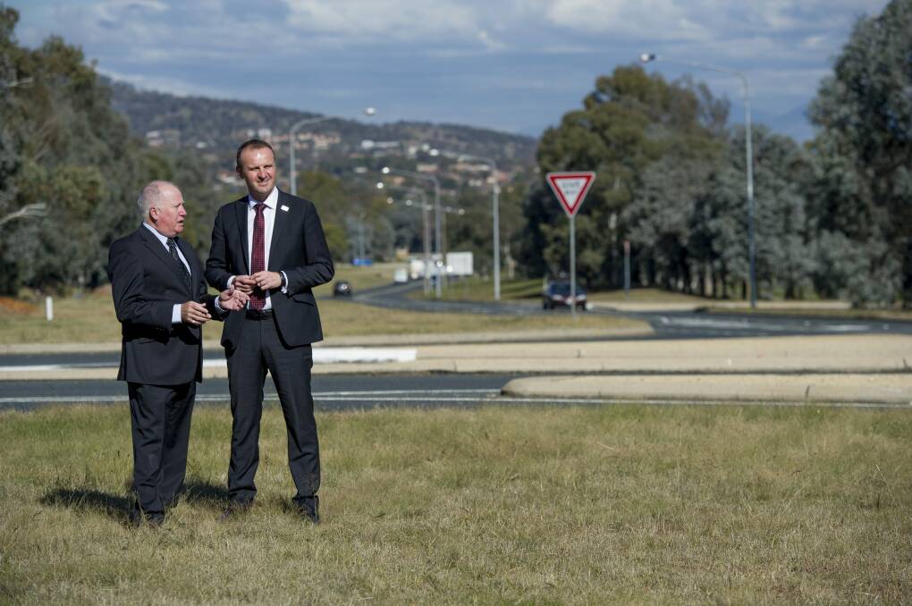 Then Roads Minister Mick Gentleman and Chief Minister Andrew Barr announcing the Tuggeranong duplication work last May. Photo: Jay Cronan