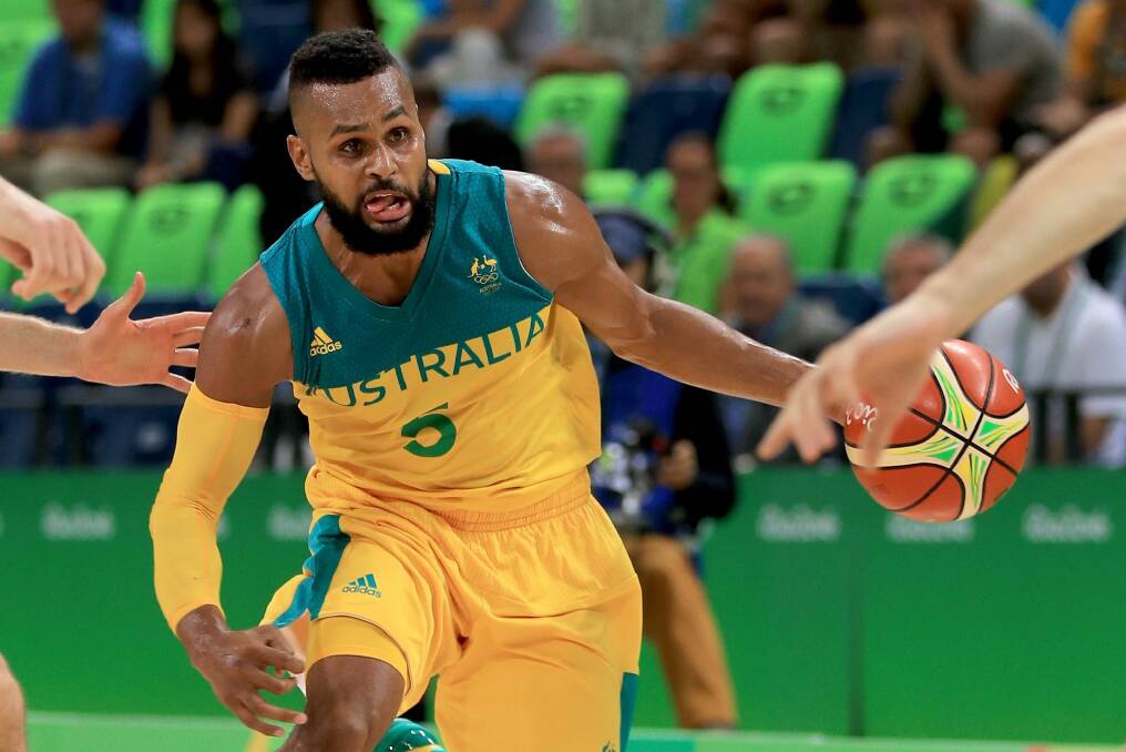 The Boomers want to head to Canberra with home town hero Patty Mills but the move depends on the future of the AIS. Photo: Getty Images