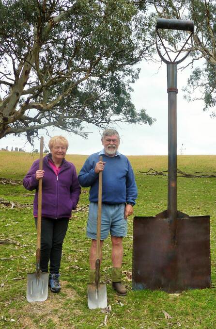 Liz and John Baker at Garden Spade (by Rosalind Lemoh) in their sculpture paddock. Photo: Tim the Yowie Man