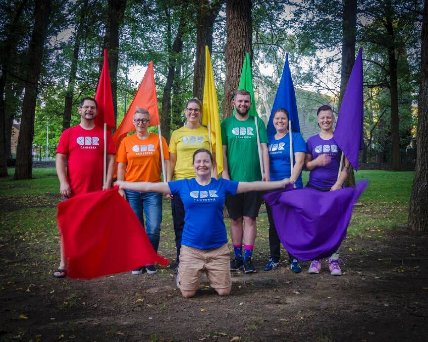 Members of the Capital Queers group wearing their rainbow CBR t-shirts at their final rehearsal before Mardi Gras. Pictured are Rodney Clapham, Ann-Marie Pesticcio,Emma Webster, Michael Smith, Amy Dean, Jolene Mifsud and Hannah Dawson (front). Photo: Supplied