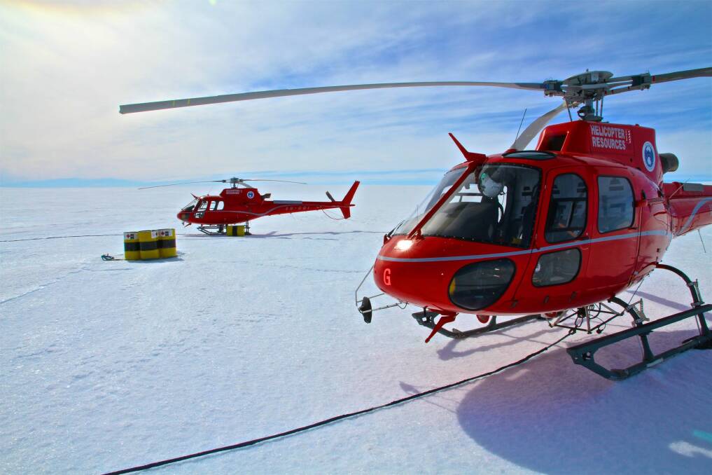 A photograph by David Wood of his and Paul Sutton's helicopters at the western ice shelf fuel cache on December 28, 2015. Photo: David Wood