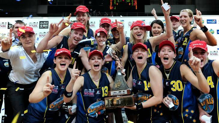 Canberra Capitals players celebrate winning the 2008-09 WNBL title. Photo: Marina Neil