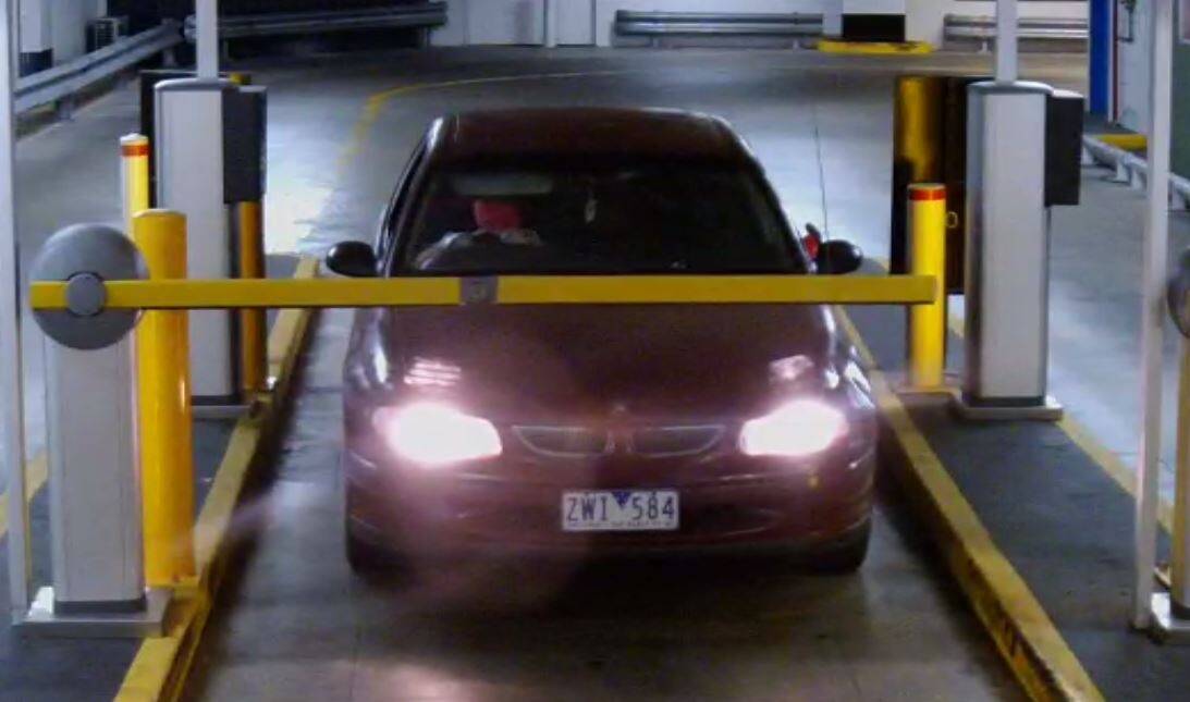 Three men leave the Canberra Centre in a Holden Commodore with stolen plates. Photo: Russell, Benjamin