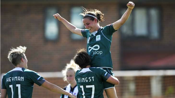 Nicole Sykes is congratulated after scoring a goal against Newcastle. Photo: Jay Cronan