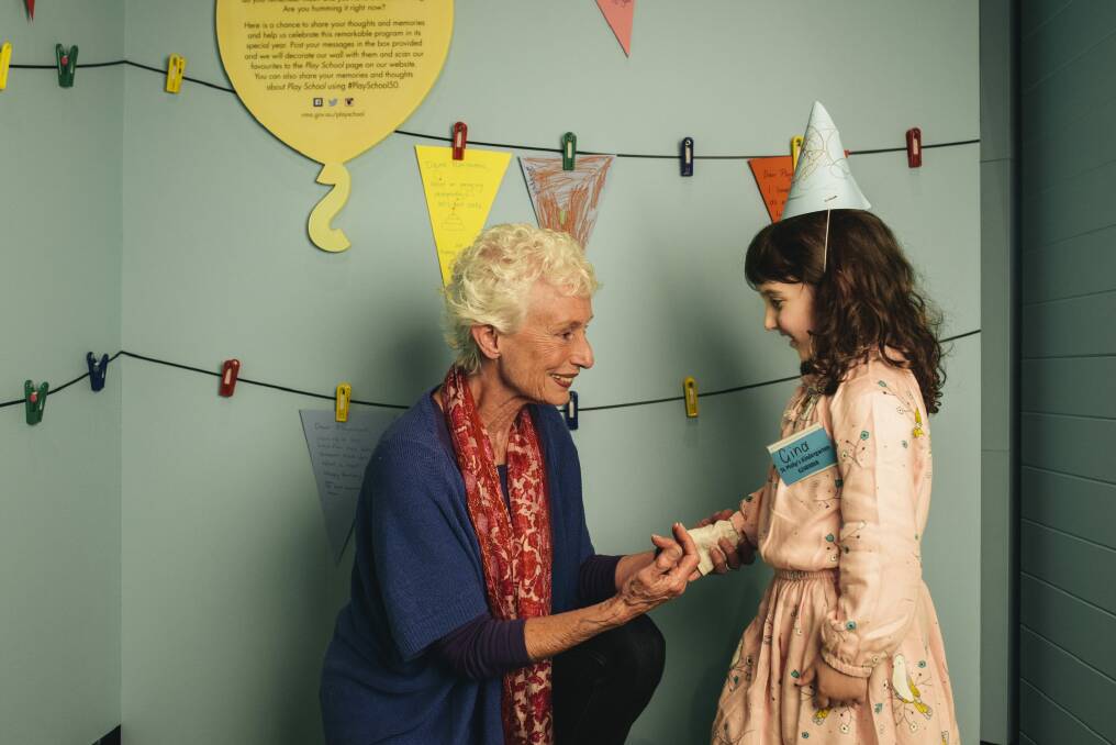 Play School presenter Benita Collings meets Gina Farrington, 4, of O'Connor at the Happy Birthday Play School: Celebrating 50 years exhibition. Photo: Rohan Thomson