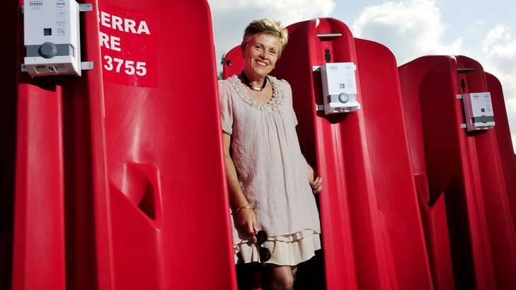 Convenience ... Canberra CBD Limited Jane Easthope with the portable urinals being trialled in the city. Photo: Jay Cronan