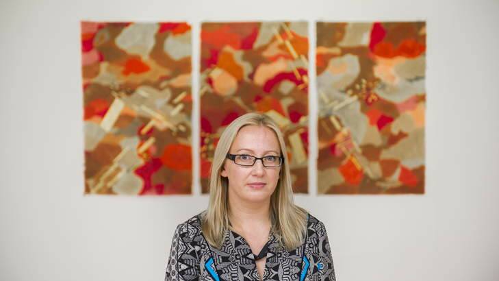 Portrait of Canberra artist Katy Mutton with her work, Harbingers, at the Canberra Contemporary Art Space. Photo: Rohan Thomson