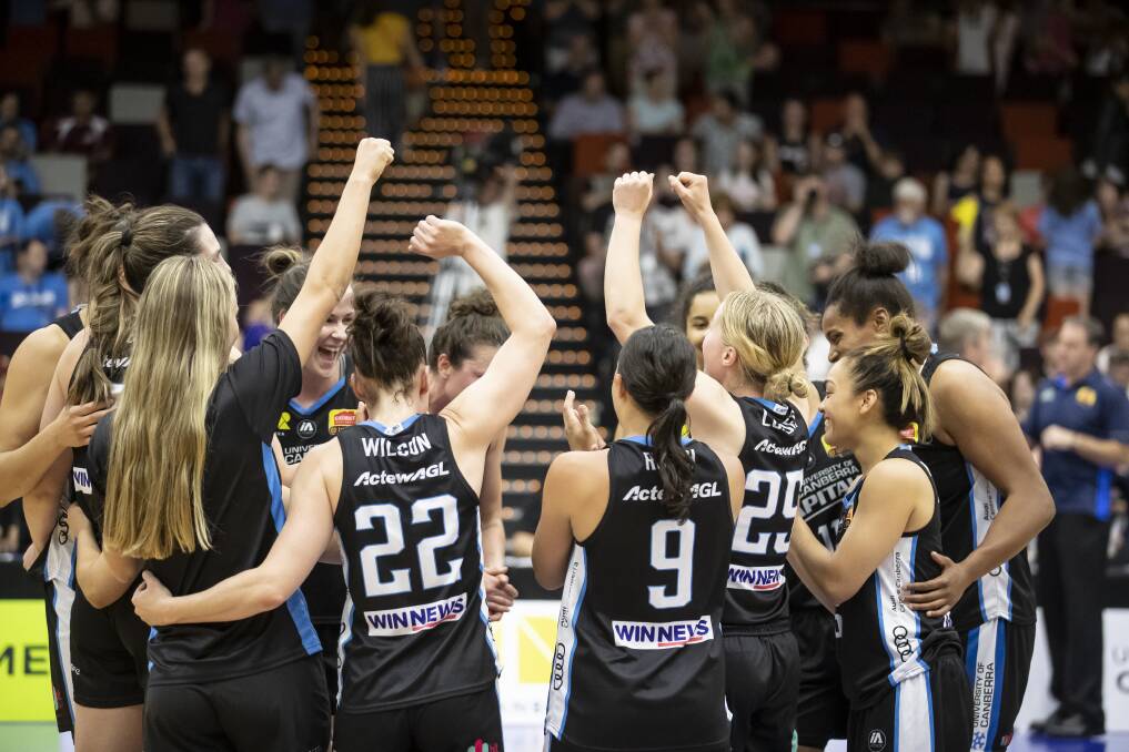 The Canberra Capitals celebrate. Photo: Sitthixay Ditthavong