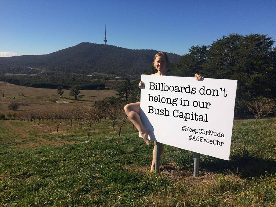Deb Cleland poses in a cheeky social media campaign hoping to keep Canberra billboard-free.  Photo: Lisa Petheran