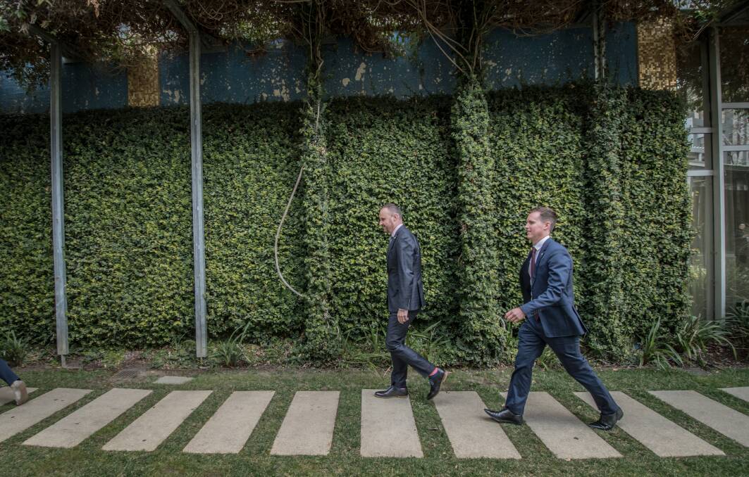 ACT Chief minister Andrew Barr and his new minister Chris Steel exit the courtyard of the ACT Legislative Assembly.  Photo: Karleen Minney
