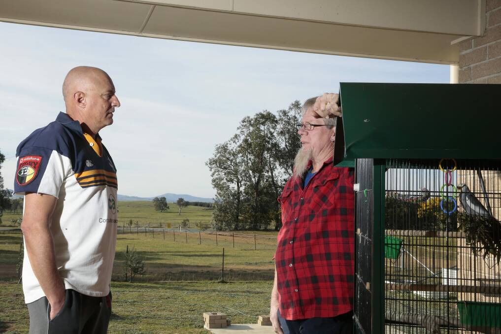 Uriarra residents Michael Friedrich and Lance Ollerenshaw discuss the planned solar farm. Photo: Jeffrey Chan