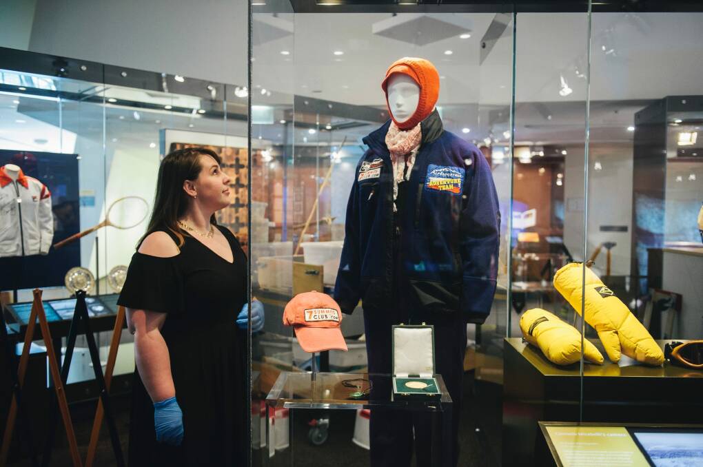 National Museum of Australia curator Mikhala Harkins with part of a new display about Canberra mountain climber Lincoln Hall. Photo: Rohan Thomson