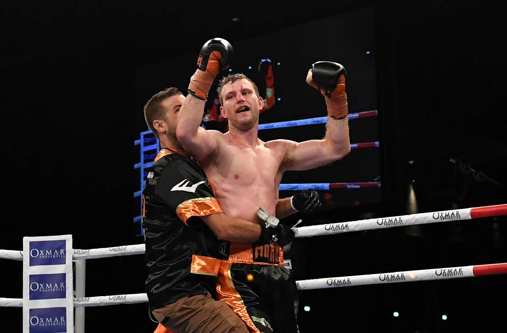 Ben Horn embraces Jeff Horn following his first title defence. Photo: AAP