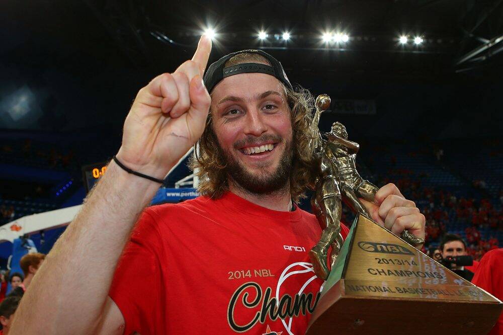 Wildcats player Jesse Wagstaff with the NBL trophy. Photo: Getty Images