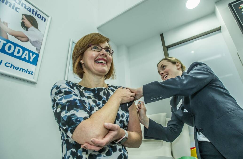 Minister for Health and Wellbeing, Meegan Fitzharris announces that ACT pharmacists with appropriate training may now administer Pertussis (whooping cough) vaccine to adults, without a prescription. Chemist Elise Apolloni administers an injection at the Wanniassa Capital Chemist.  Photo: Karleen Minney