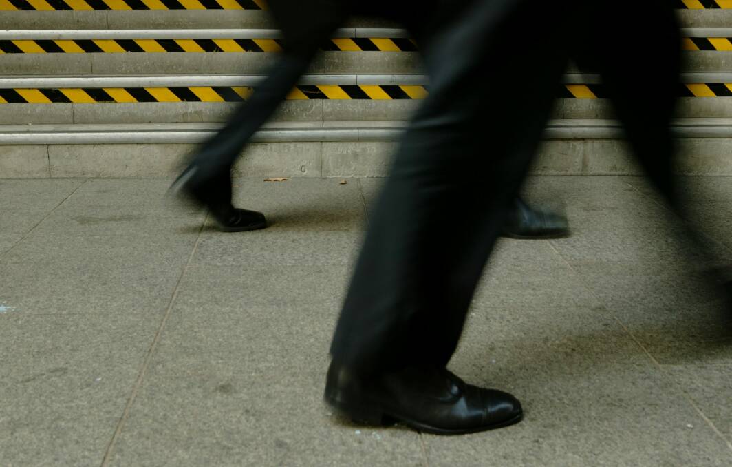 Business. Photo shows two businessmen walking. 25 May 2005. AFR Photo by Andrew Quilty. Generic business, risk, risky business, hazard, hazardous, corporate, corporation, fraud, danger, caution. SPECIALX 37052 Photo: Andrew Quilty AQU