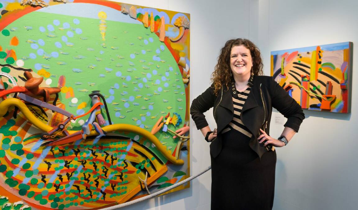 Justine Van Mourik, director of the Parliament House Art Collection, with two pieces from Design in the Decade which showcases the 1980s.   Photo: David Hempenstall