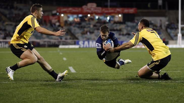 Nic White scores a try against the Hurricanes last Friday. Photo: Jeffrey Chan