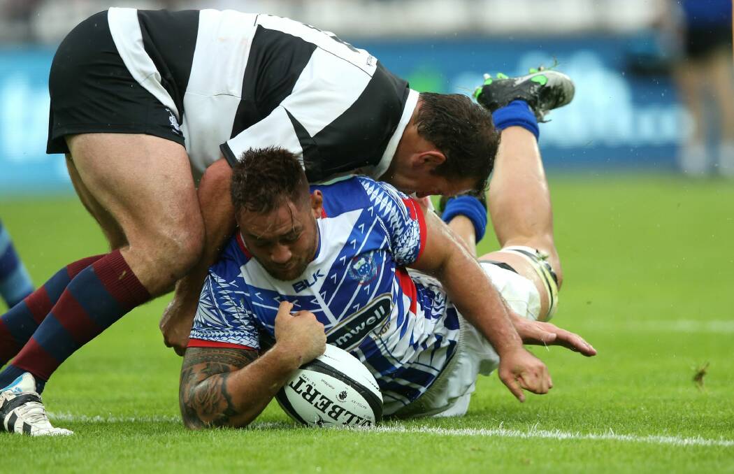 Living the dream: Jack Lam, of Samoa, dives over for a try during a World Cup warm-up match against the Barbarians. Photo: David Rogers