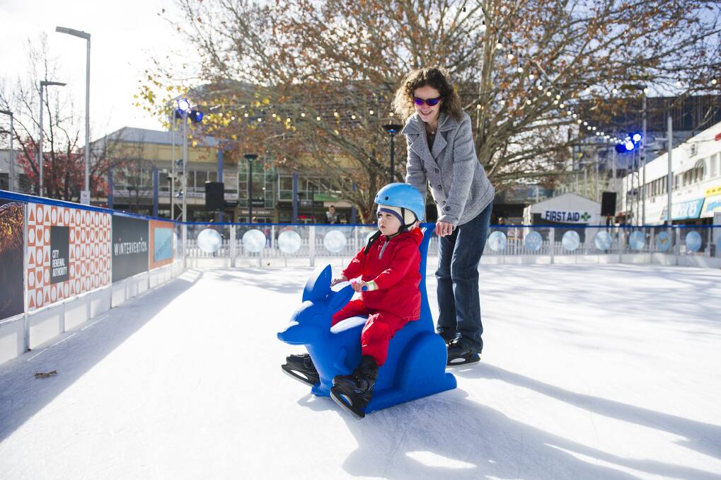 Nicole Johnson and Ivy, four, ice skating at Canberra's Wintervention festival. Photo: Dion Georgopoulos
