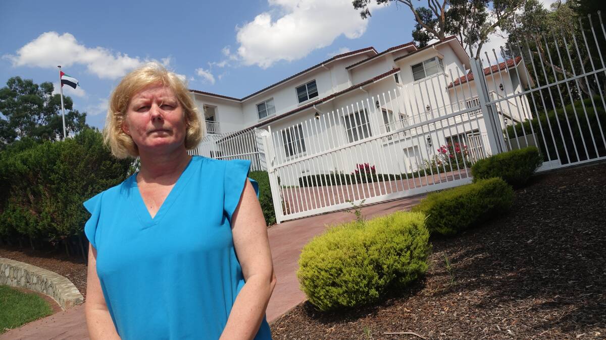 Unhappy neighbour. Mandy Harris in front of the embassy. She says it is not allowed in her residential street. Photo: Steve Evans