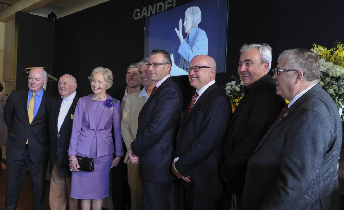 Celebrating the life of Betty Churcher at the National Gallery of Australia. From left, Gerard Vaughan, John Olsen, Dame Quentin Bryce, Ben, Paul and Tim Churcher, Senator George Brandis, Peter Churcher and Alan Dodge.
 Photo: Graham Tidy