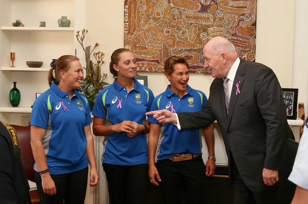 Sally Moylan, left with Ash Gardner and Shelley Nitschke, gets some advice from Governor-General Sir Peter Cosgrove. Photo: Alex Ellinghausen
