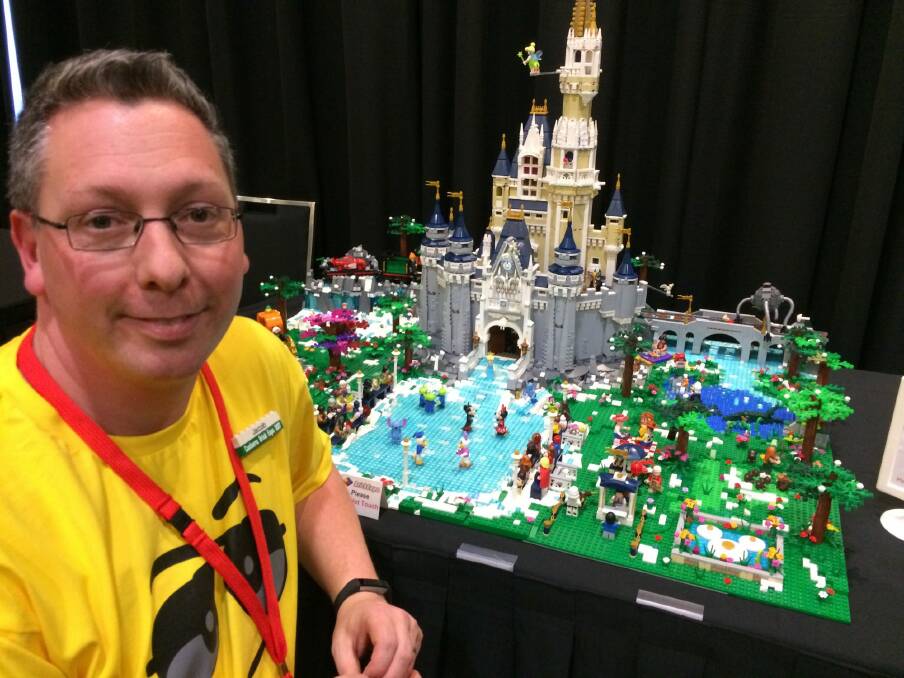 Isabella Plains banker Jacob Krog can't help but like Lego - he grew up in Denmark, the land of Lego. His Disney creation at Brick Expo at the Hellenic Club took 100 hours to build. Photo: Megan Doherty