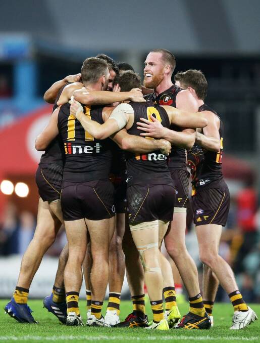 Jarryd Roughead celebrates with his teammates after his match-winning goal. Photo: Getty Images