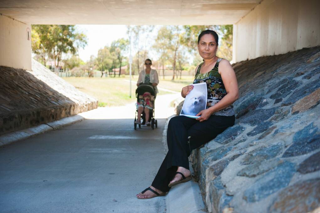 Monash woman Ravinder Singh with a picture of her dog, Milo, who was run over by a cyclist in this Drakeford Drive underpass. Photo: Elesa Kurtz