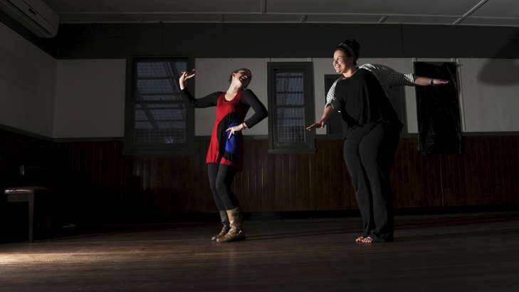 Dancing in the dark... organisers Lucy Nelson and Lisa Sampson take a twirl on on the dance floor, before a No Lights No Lycra event in Ainslie. Photo: Graham Tidy