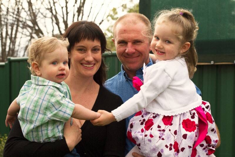 Three-year-old Annabelle Potts (right) has been diagnosed with a rare and aggressive brain tumour. She is pictured with brother William (left) mother Kathie (second from left) and father Adam (second from right).  Photo: Supplied