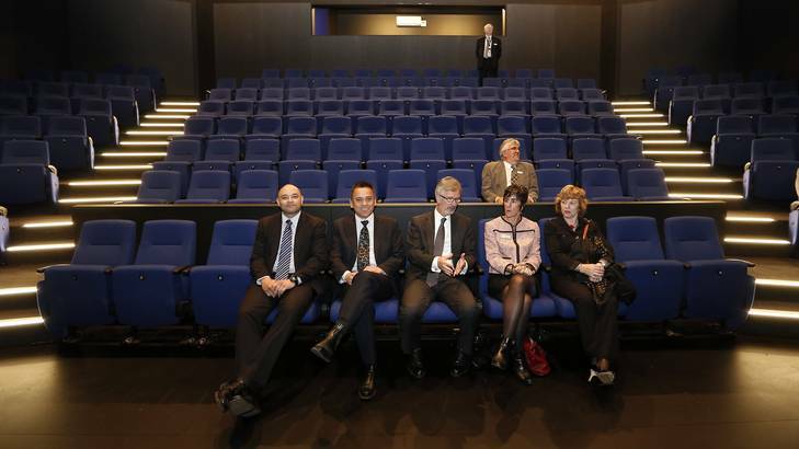 Stephen Gwilliam, left, John Stenhouse, Minister for Education and Training Chris Bourke, Belinda Bartlett, Kerrie Grundy, and George Palavestra, rear, test the seats in the new $9.35 million Canberra College Performing Arts Centre. Photo: Jeffrey Chan