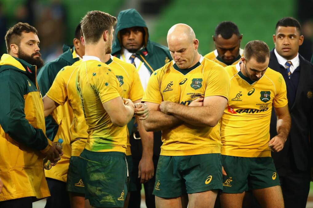 Downcast: Wallabies captain Stephen Moore and teammates look dejected after losing the series in Melbourne. Photo: Getty Images
