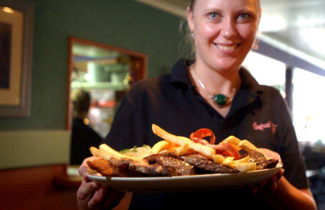 Former waitress Anna Randall with the mixed grill. Photo: Marina Neil