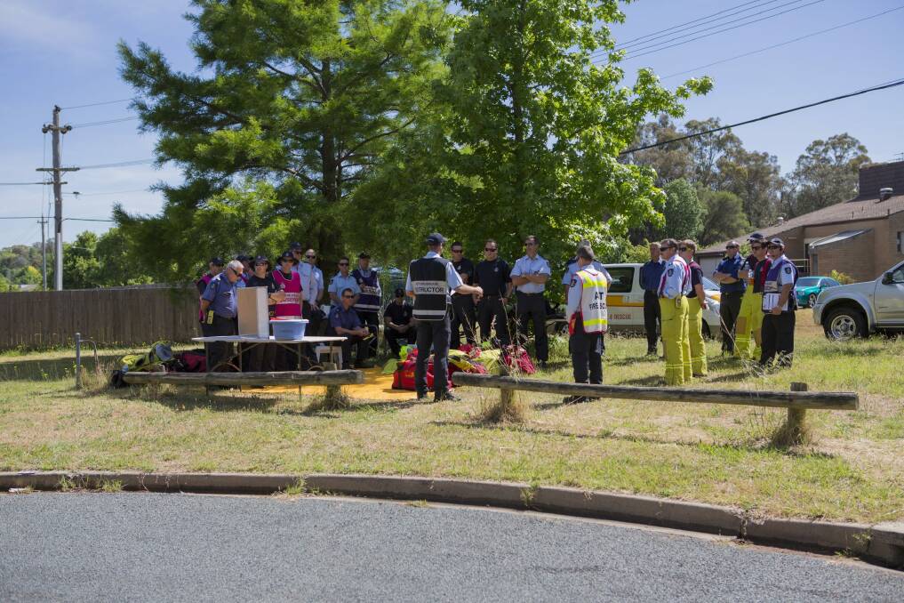 Briefing: ACT Fire and Rescue at the scheduled house fire in Farrer on Thursday. Photo: Jamila Toderas