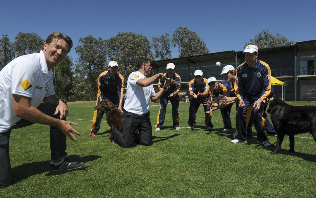 Sound technique: Members of the ACT blind cricket team at the ANU North Oval
with Australian cricket legends Glenn McGrath, bowling, and Mike
Hussey, with the bat.  Photo: Graham Tidy