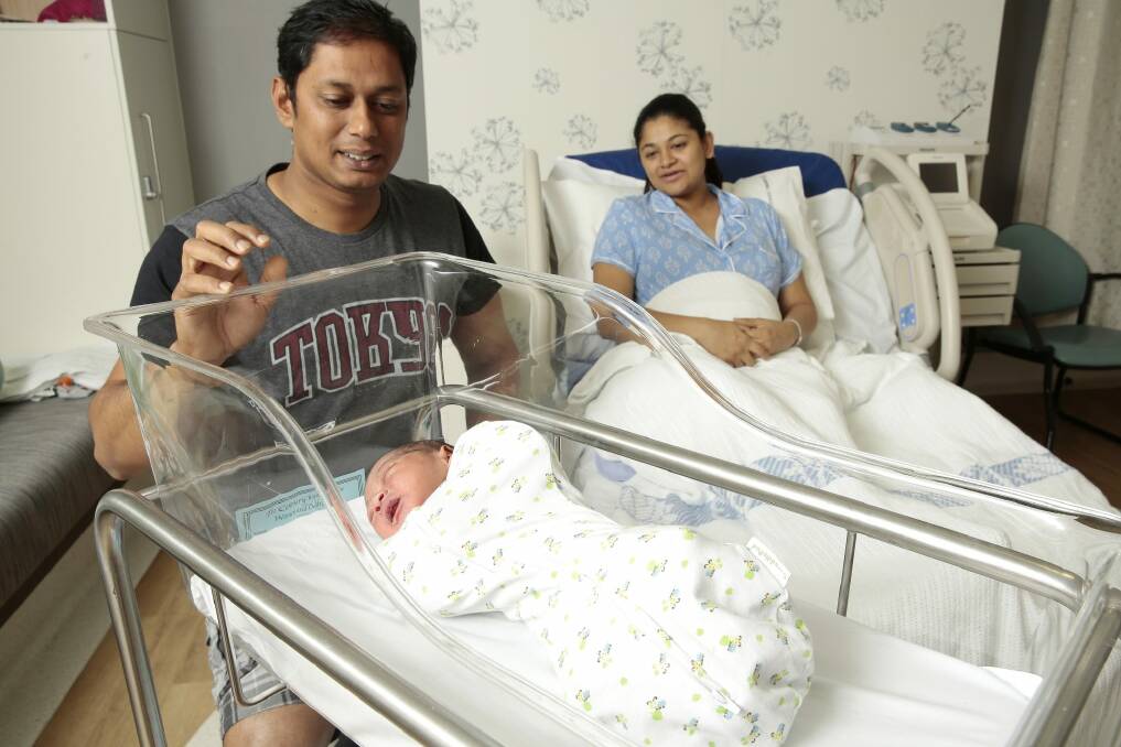 Mum Seethal Menon of Watson with partner Thomas George and their new baby boy Ronith born at 12:59am at the Centenary Women and Children's Hospital on New Years Day.  Photo: Jeffrey Chan