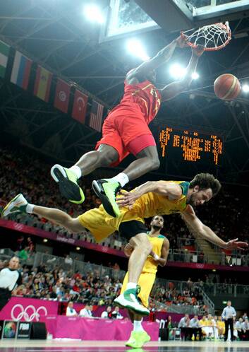 Pressure rising .... Spain's Serge Ibaka dunks over Matt Nielsen. Photo: Getty Images