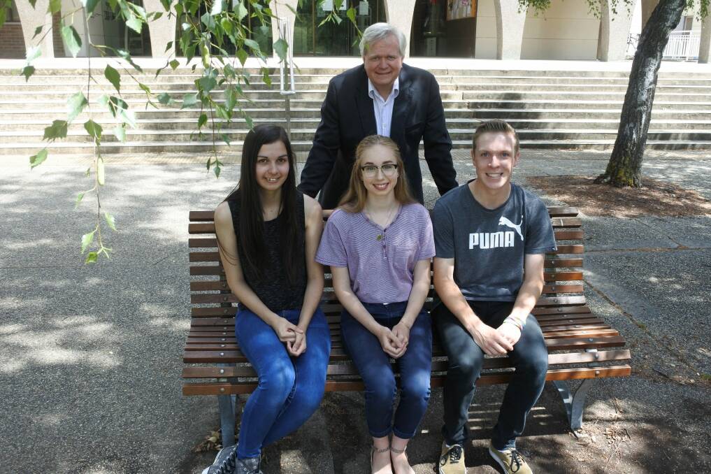 ANU Vice-Chancellor Professor Brian Schmidt with ACT students Katrina Gibbins, Georgia Larsen and Joshua Guest who have received early 2017 places. Photo: Georgina Connery