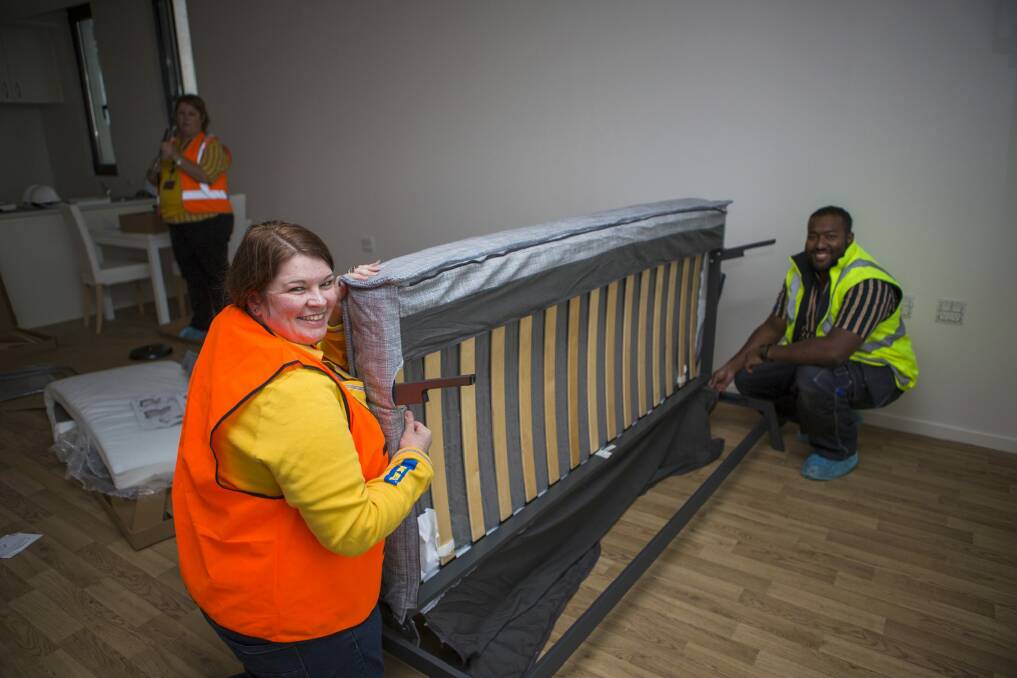 Ikea's customer support manager Leanne Wilding and recovery manager Saif Islam prepare furniture for the Common Ground public housing facility. Photo: Jamila Toderas