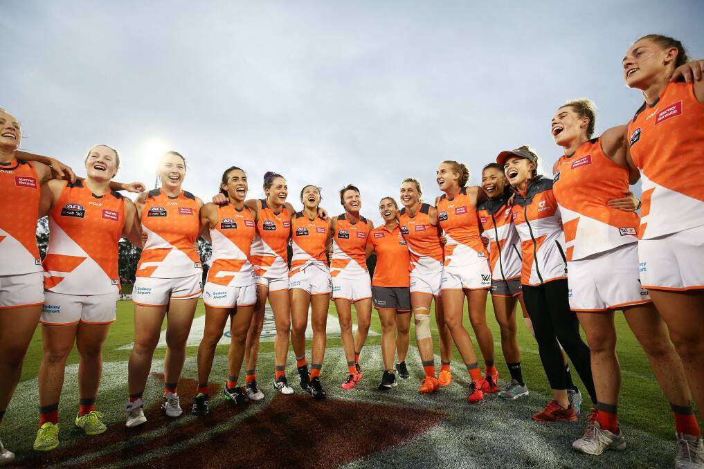 Giants players celebrate victory following the round five AFL Women's match between the Greater Western Sydney Giants and the Melbourne Demons.  Photo: Brendon Thorne
