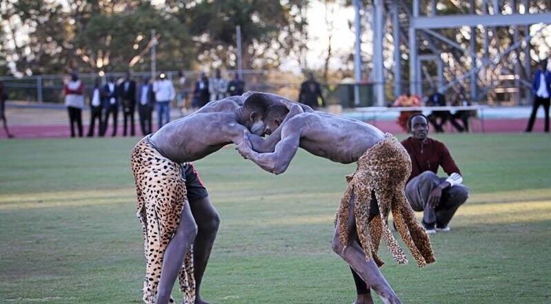 Kudum Kudum (right) wrestling against Queensland's Aueng Chol at the national championships. Photo: Ayuen Thiong Makur