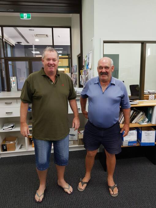 Bega Court registrar John Chalker, left, and court officer Paul McGrath, right, went to work on Monday unsure if their homes were still standing. Photo: Justice NSW