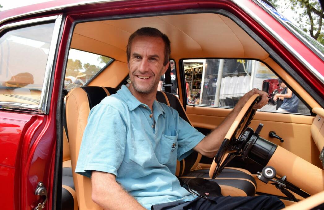 Todd Bulkeley, 38, of Lithgow, has had a passion for Japanese sports sedans since before the accident that left him a paraplegic 19 years ago. He has fitted hand controls to his Datsun 1600 SS coupe so he can drag race it next year.  Photo: David Ellery