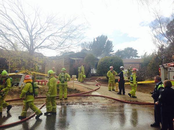 Firefighters at the scene of a McKellar house destroyed by fire Photo: Henry Belot