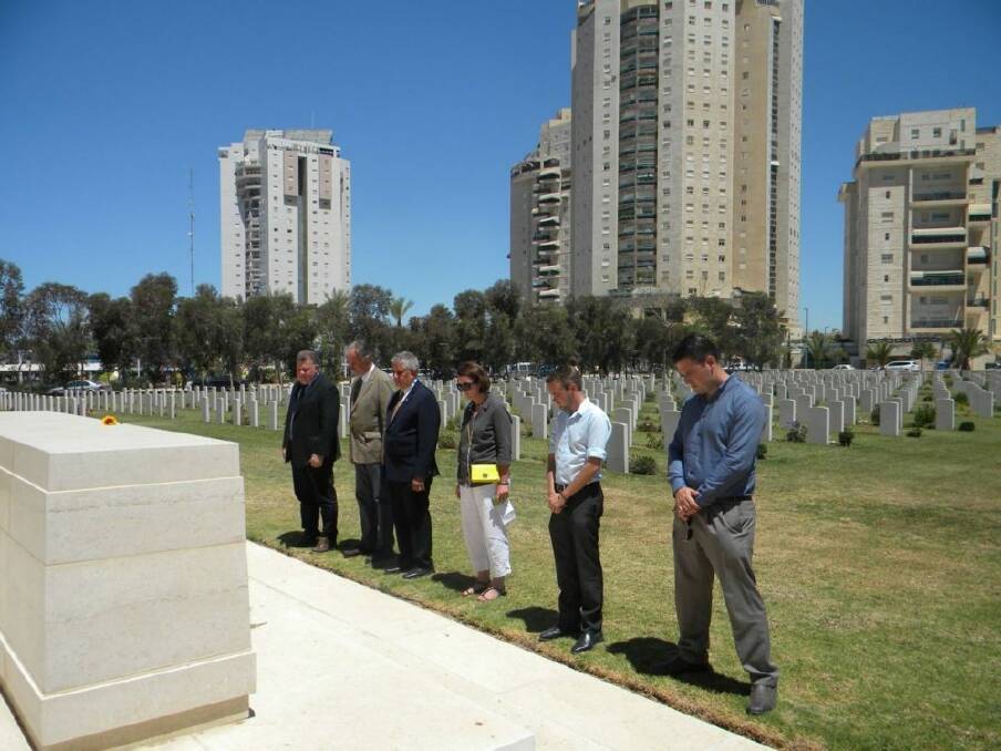 Senator  Seselja and colleagues pay their respects at the Beersheba War Cemetery.  Photo: Supplied