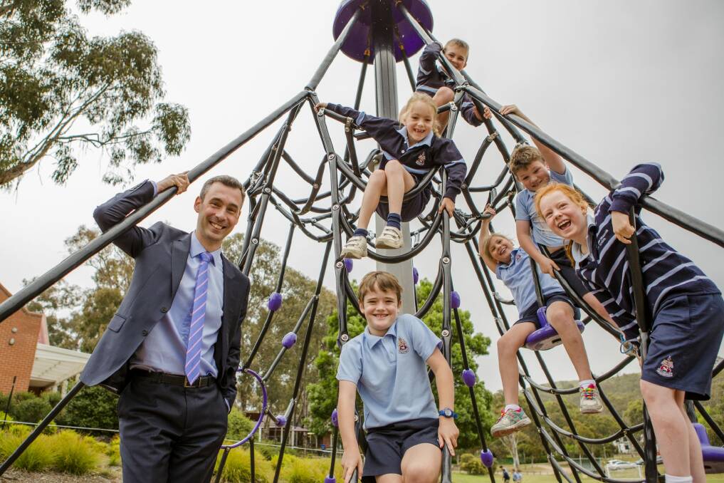 Principal Justin Garrick, pictured with year 2 students, announced on Tuesday that Canberra Grammar will become co-educational. Photo: Jamila Toderas